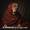 A dog wrapped in red fabric in front of a dark background