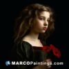 A girl with dark hair is holding a red poppy