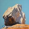 A painting of a boulder on a rocky mountaintop