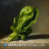 A painting of a spinach leaf on a table