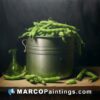 A painting of green beans in a bucket on a table
