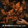 A painting of leaves and a hand reaching for them