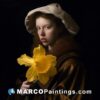 A woman in brown clothing with a yellow narcissus