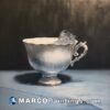 An oil painting of an empty tea cup with an ice cube inside