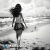 Black and white drawing of girl walking along beach