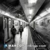 Black and white drawing of two people in a subway station